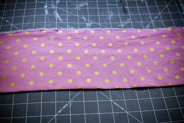 3. Press contrast fabric in half