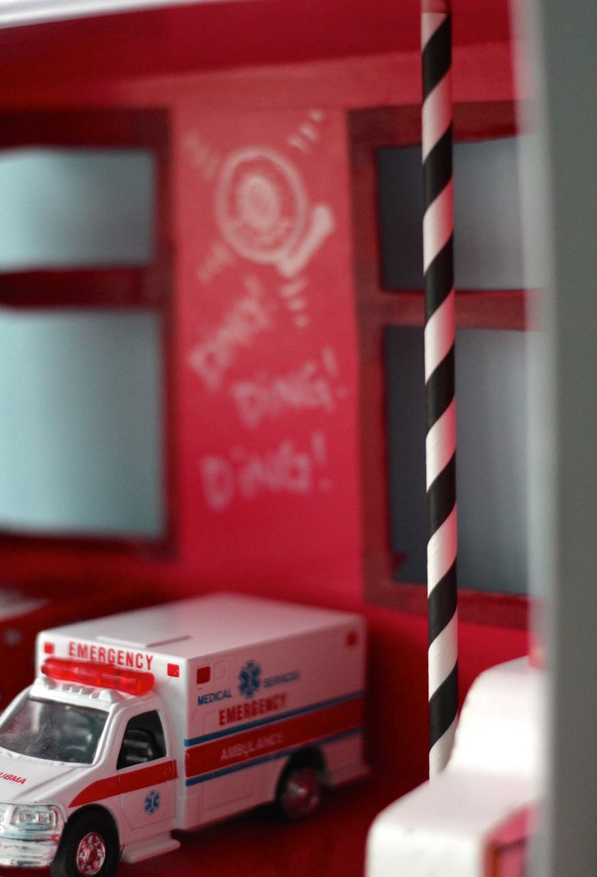 Cardboard-Fire-Station-with-a-fun-striped-fire-pole-?-great-for-imaginative-play