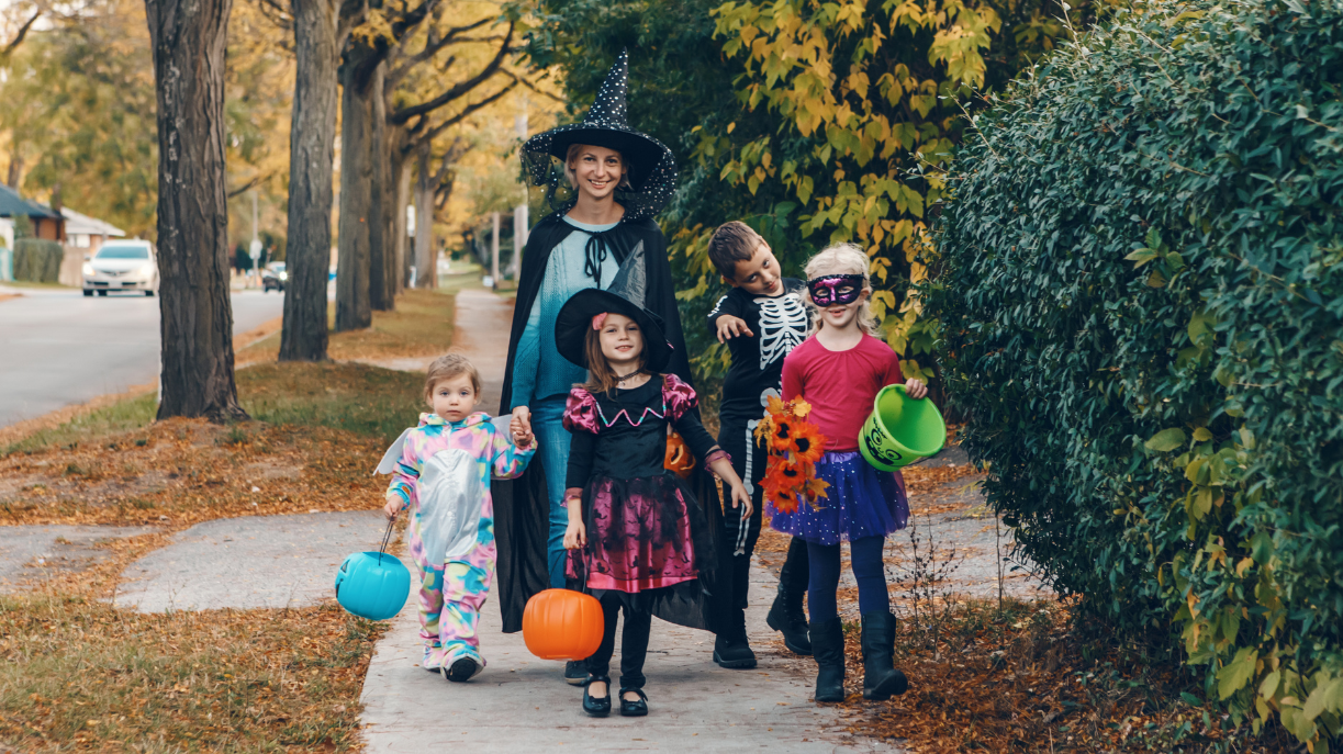 mom dressed-up for Halloween with group of kids